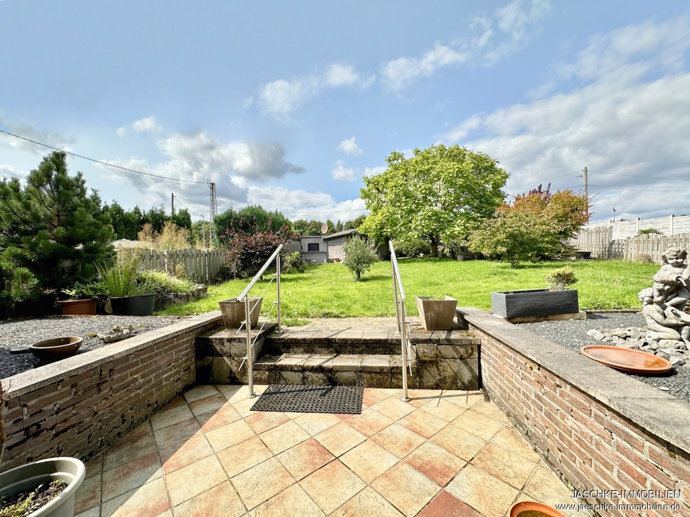 Zweifamilienhaus Stolberg (Rheinland) / Breinig kaufen Phi: Terrasse Immobilienmakler Stolberg (Rheinland) / Breinig Zweifamilienhaus kaufen mit Immobilienbewertung