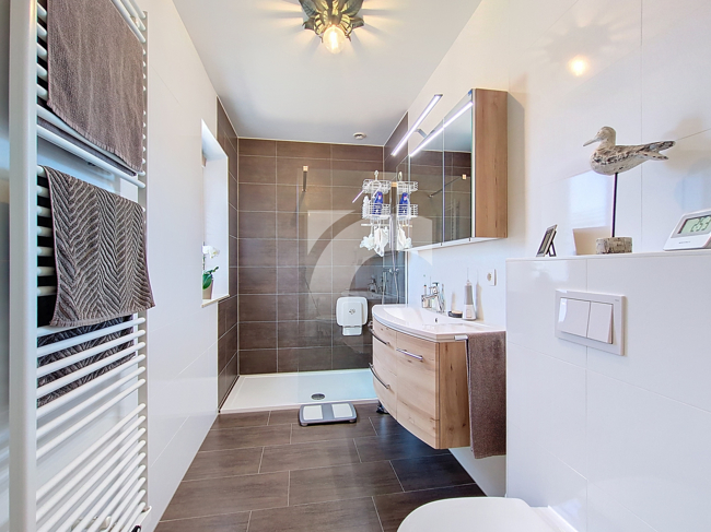 Immobilienmakler Kelmis DG-Wohnung kaufen mit Immobilienbewertung